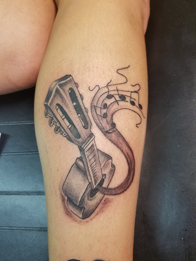 Explore cross tattoo ideas for guys, creative tattoo ideas in Phenix City, available at Skin Traditions Tattoo Studio