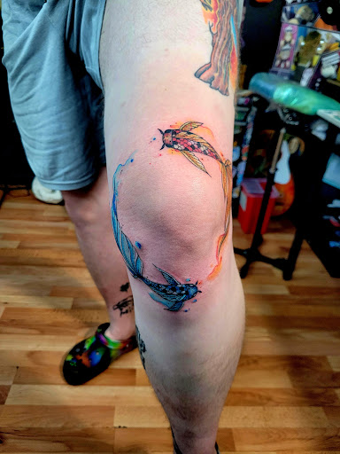 Explore water lily tattoo ideas, creative tattoo ideas in Benton, available at Spectrum Tattoo