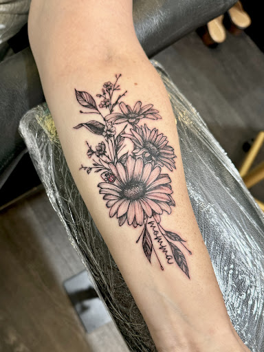 Explore tattoo ideas for men lower arm, creative tattoo ideas in Charlotte, available at Olive Branch Tattoo Studio