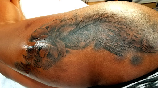 Explore tattoo on bicep ideas, creative tattoo ideas in Virginia Beach, available at World Famous Blue Horseshoe Tattoo and Piercing Independence