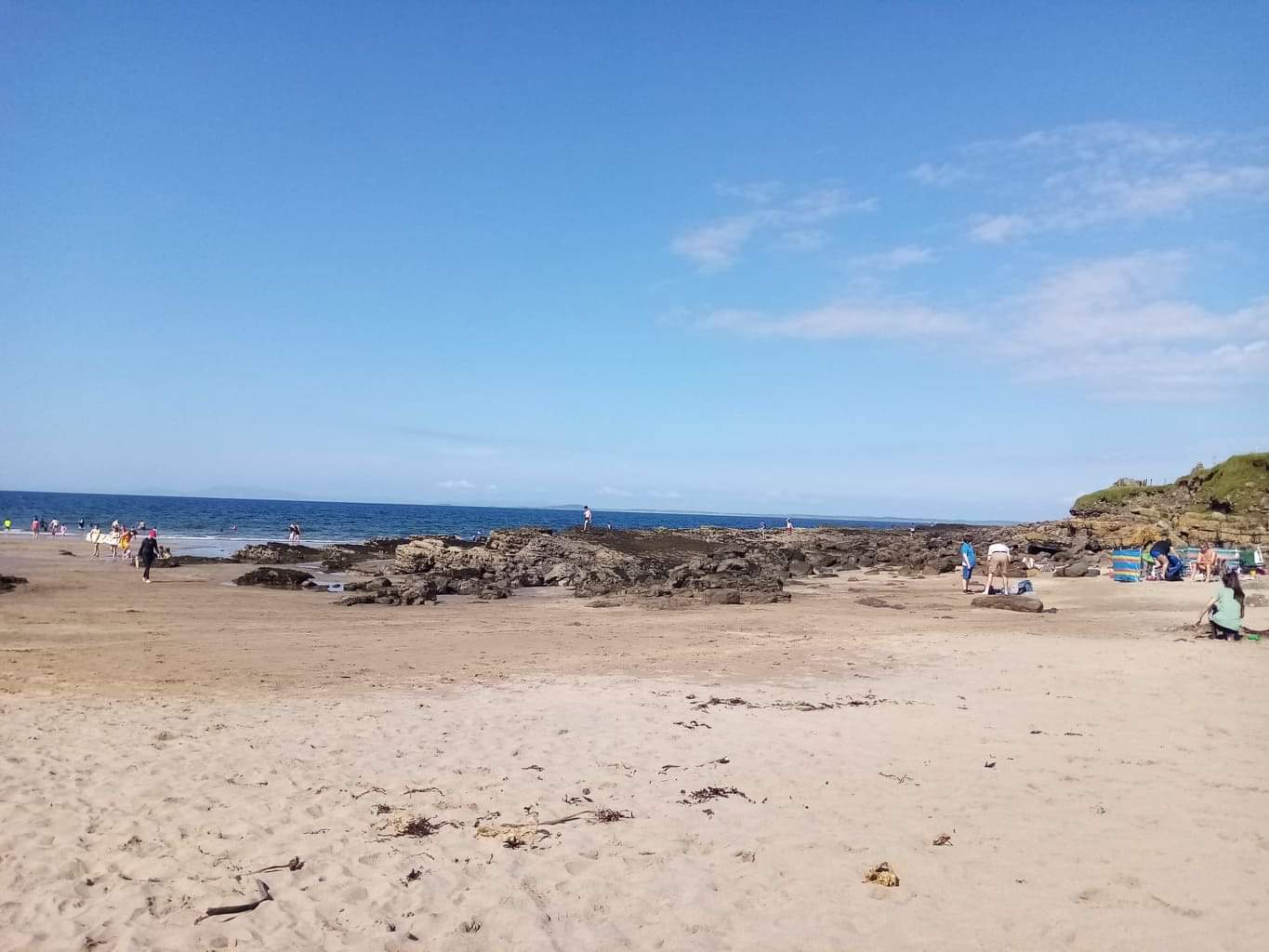 Foto av Dunmoran Beach och bosättningen