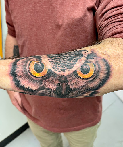 Explore black bear tattoo ideas, creative tattoo ideas in Marietta, available at Monkeys Uncle Tattoo