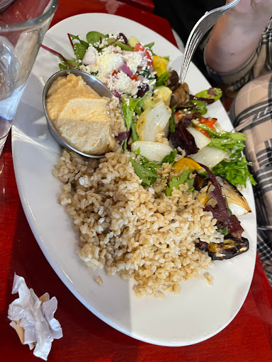 Veggie kabob with Mediterranean salad and wheat rice. 