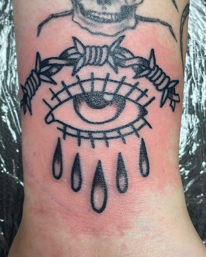 Explore tattoo ideas for a name cover up, creative tattoo ideas in Marietta, available at Monkeys Uncle Tattoo