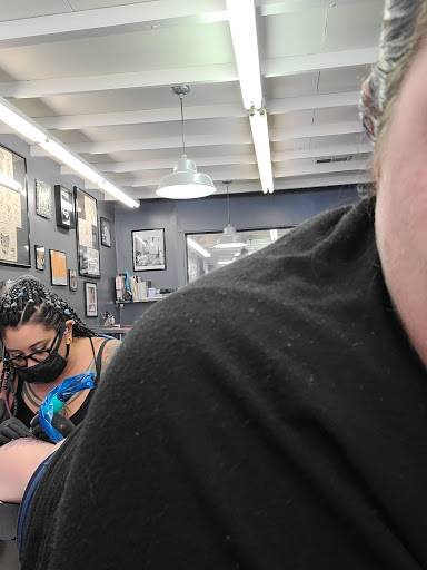 Explore men's back shoulder tattoo ideas, creative tattoo ideas in Sioux City, available at Maya Modification