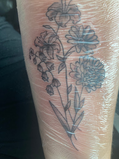 Explore leg tattoo ideas for men black, creative tattoo ideas in Louisville, available at Imperial Tattoos