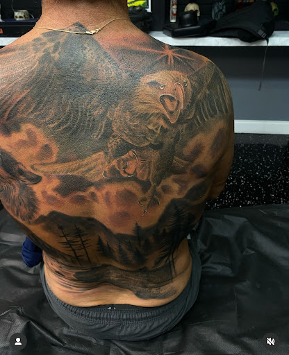 Explore pink ribbon tattoo ideas, creative tattoo ideas in Fort Myers, available at Loyal 2 The Coil Tattoos & Piercings (Edison Mall Location Entrance F)