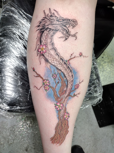 Explore tattoo sleeve filler ideas, creative tattoo ideas in Park Hills, available at Sideshow Tattoo and Piercings