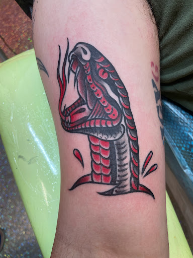 Explore forehead tattoo ideas, creative tattoo ideas in Houston, available at The Neon Jackal Tattoo