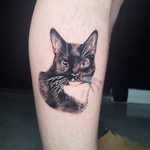 Explore mens behind ear tattoo ideas, creative tattoo ideas in Austin, available at The Dark Arts Tattoo