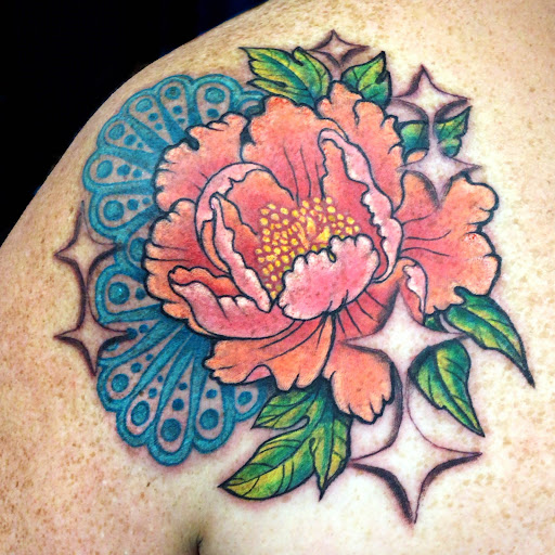 Explore tricep tattoo ideas for guys, creative tattoo ideas in Topeka, available at Looking Glass Tattoo & Gallery