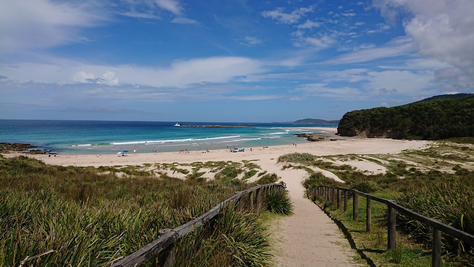 Foto de Pretty Beach con arena fina beige superficie