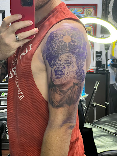 Explore grinch tattoo ideas, creative tattoo ideas in Phoenix, available at HIGH NOON TATTOO