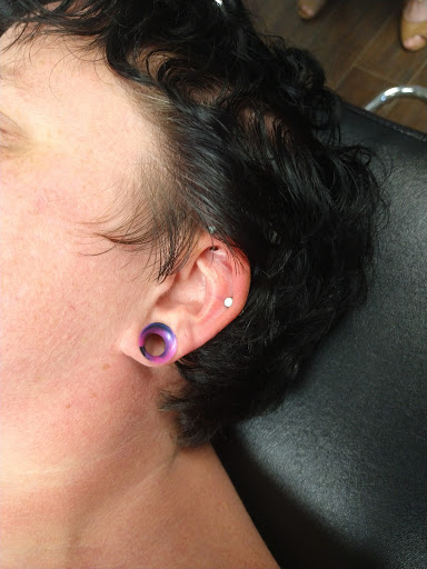 Explore chin tattoo ideas, creative tattoo ideas in Bloomington, available at Evil by the Needle Custom Tattoo and Piercing Studio