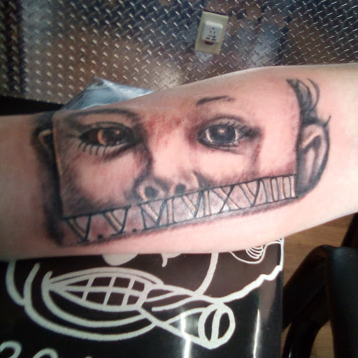 Explore small spooky tattoo ideas, creative tattoo ideas in Dayton, available at Uppity Tattoos