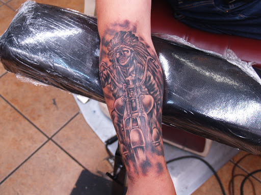 Explore black power tattoo ideas, creative tattoo ideas in Seattle, available at Fenix Tattoo and Piercing