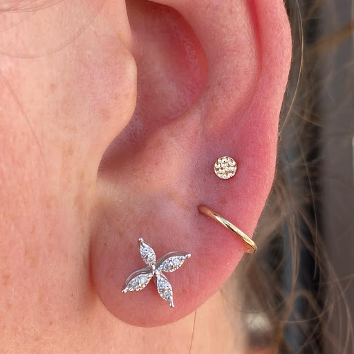 Explore spine tattoo ideas for men, creative tattoo ideas in Dover, available at Agap Body Piercings