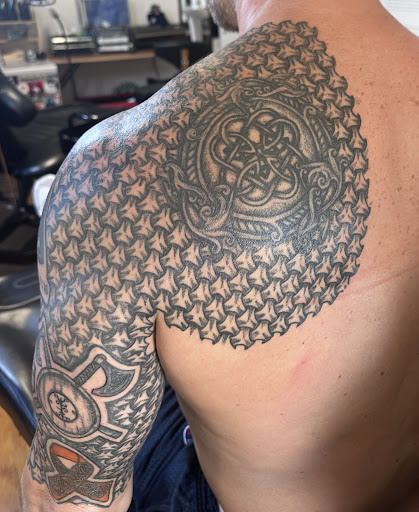 Explore lioness tattoo ideas, creative tattoo ideas in Raleigh, available at Conspiracy Ink Tattoos