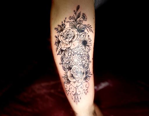 Find compass tattoo ideas for females for your next unique tattoo in Lake City at Crooked Spines Tattoo Studio