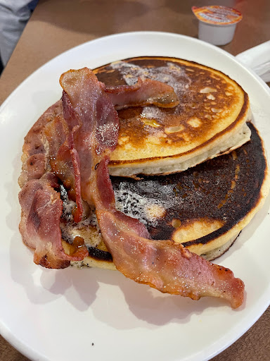 Two stack with bacon. One pancake over cooked 😞 