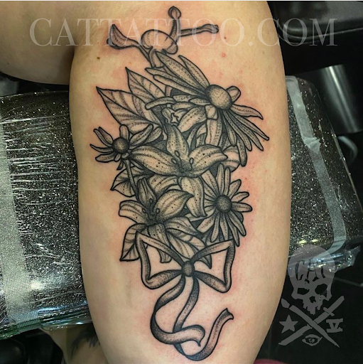 Explore female thigh tattoo ideas, creative tattoo ideas in Addison, available at Cat Tattoo