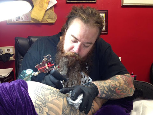 Explore cross tattoo ideas for guys, creative tattoo ideas in Arlington, available at Lady Octopus Tattoos