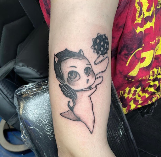 Explore cherub angel tattoo ideas, creative tattoo ideas in Portsmouth, available at World Famous Blue Horseshoe Tattoo and Piercing