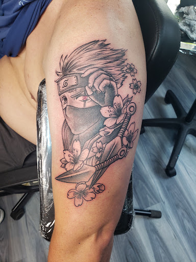 Find christmas tattoo ideas for your next unique tattoo in Pittsburgh at Electric Rex Tattoo