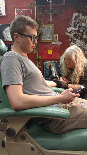 Explore grenade tattoo ideas, creative tattoo ideas in Maryville, available at Passionfish Tattoo Studio