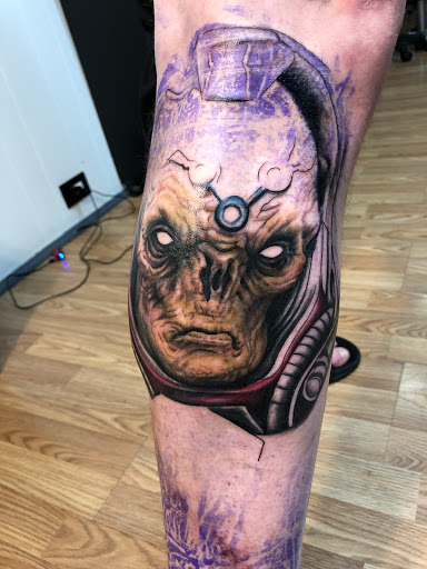 Explore throat tattoo ideas for men, creative tattoo ideas in Sarasota, available at SEVEN SINS Tattoo Studio