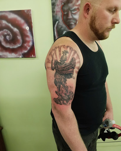 Explore black tattoo ideas for men, creative tattoo ideas in Radcliff, available at Iron Orchid Tattoo Radcliff