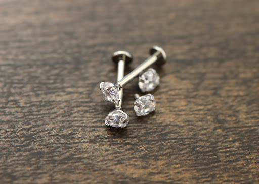 Explore woman leg tattoo ideas, creative tattoo ideas in Des Moines, available at Axiom Body Piercing Studio