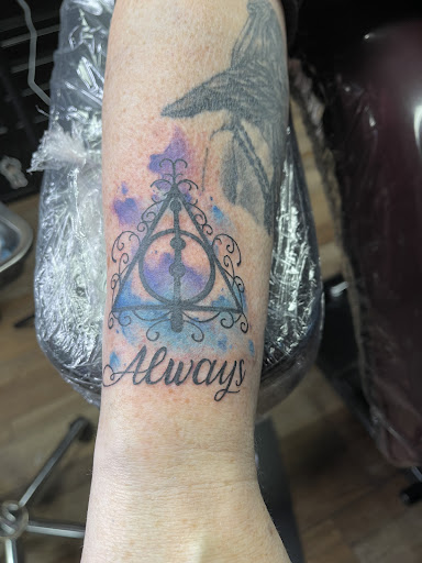 Explore athlete tattoo ideas, creative tattoo ideas in Clarksville, available at Dark Raine Tattoo