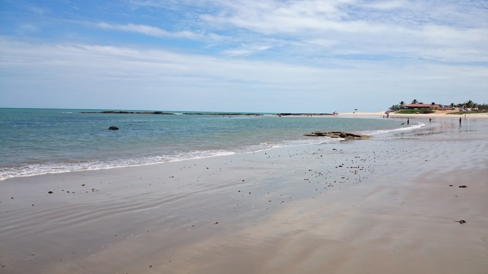 Foto av Jacuma Beach med turkos rent vatten yta