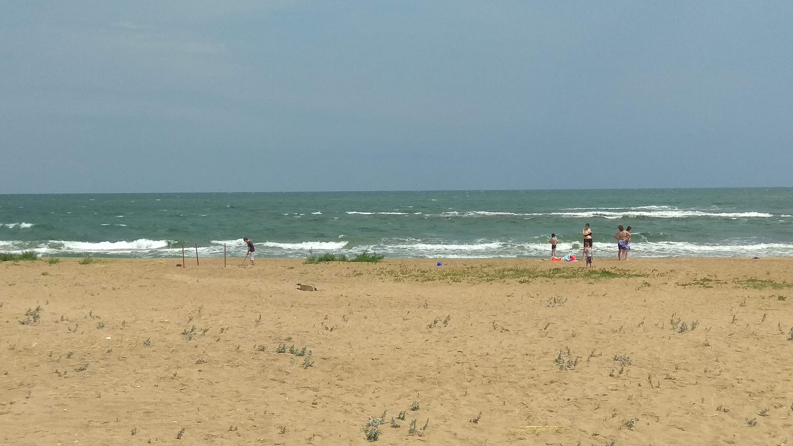 Fotografija Impul's Plazh z dolga ravna obala