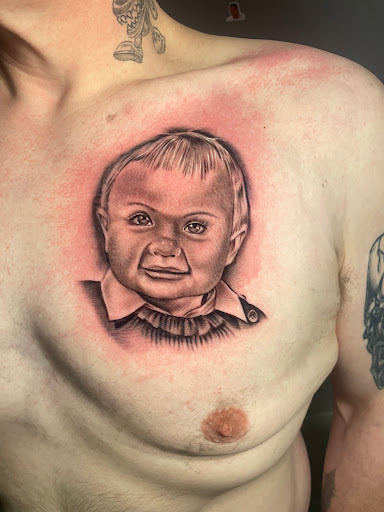 Explore tattoo ideas for photographers, creative tattoo ideas in Omaha, available at Eye Candy West Tattoo shop