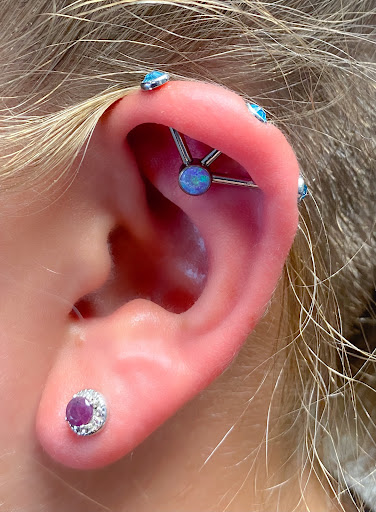 Explore tulip tattoo ideas, creative tattoo ideas in Springfield, available at Body Piercing By Qui Qui