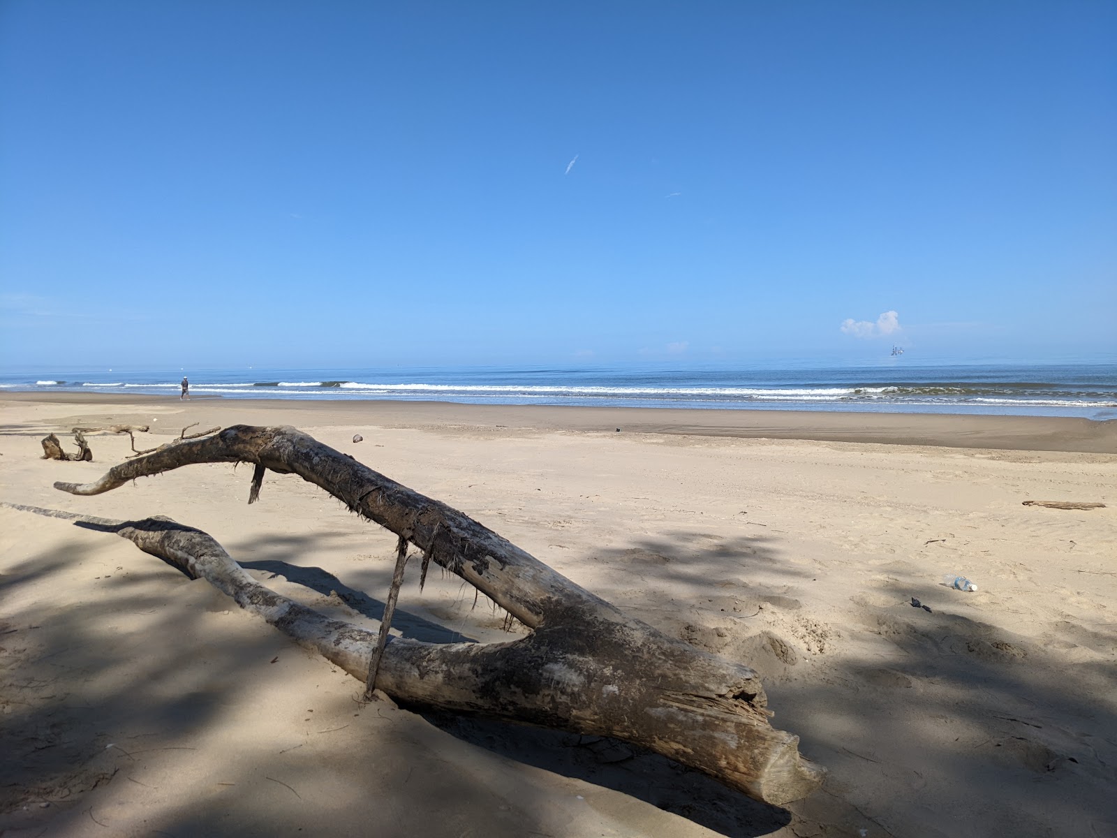 Seri Kenangan Beach的照片 带有明亮的沙子表面