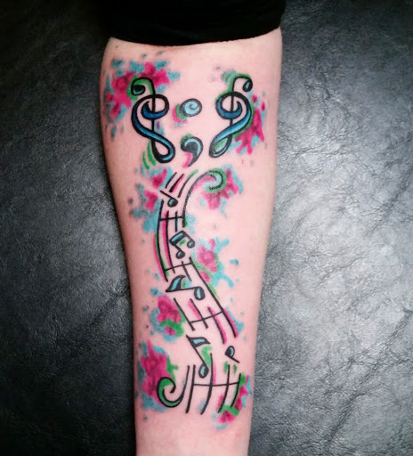 Find flower thigh tattoo ideas for your next unique tattoo in Erie at EliKingInk