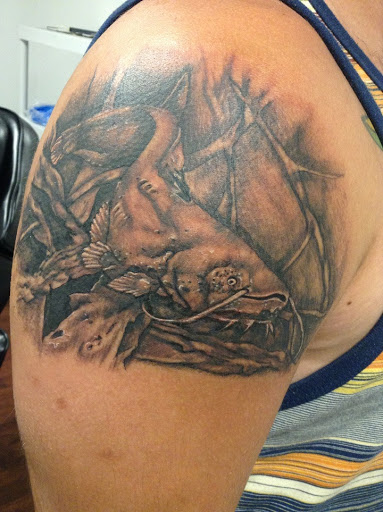 Explore small dog tattoo ideas, creative tattoo ideas in Seymour, available at American Gypsy Tattoo Corp.