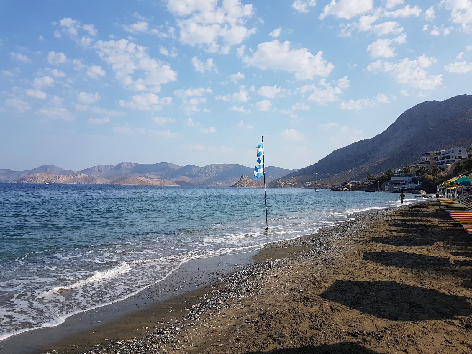 Foto van Masouri beach met blauw puur water oppervlakte
