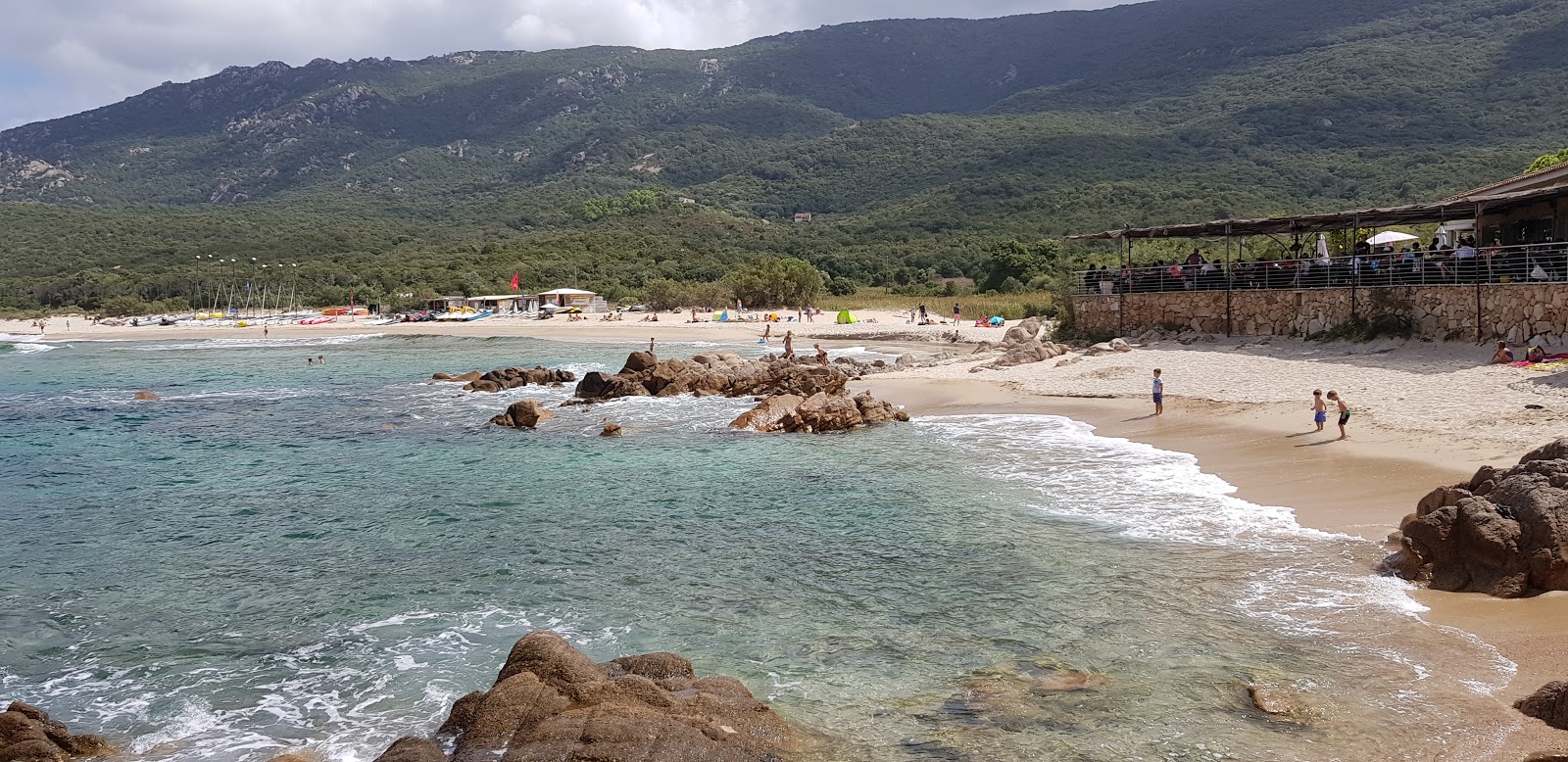 Zdjęcie Portigliolo beach z powierzchnią drobny beżowy piasek