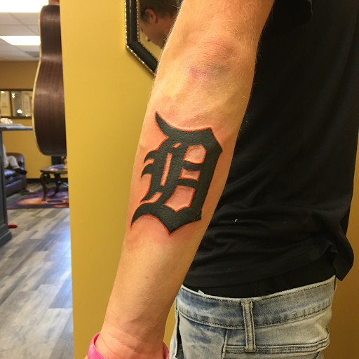 Explore cool hand tattoo ideas for guys, creative tattoo ideas in Warner Robins, available at Untold Pain Tattoo Studio