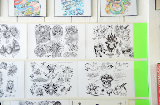 Explore knuckle tattoo cover up ideas, creative tattoo ideas in Decatur, available at Exclusive Ink Tattoos & Body Piercings 22nd & Wood