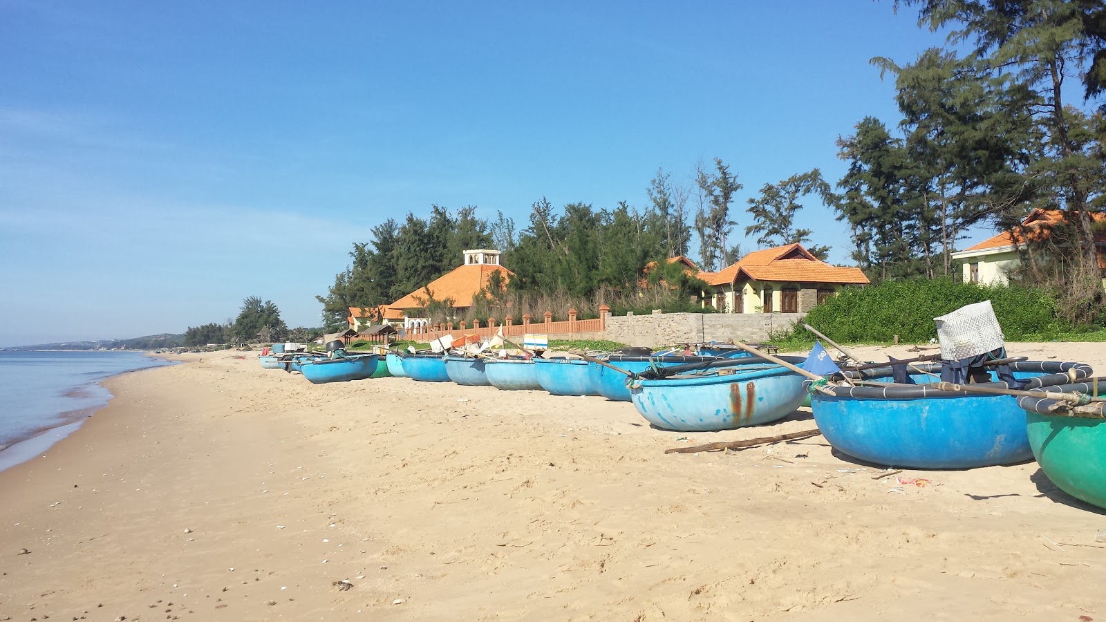 Foto de Phan Thiet Beach con arena beige superficie