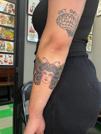 Explore christmas tree tattoo ideas, creative tattoo ideas in Cambridge, available at Kaleidoscope Tattoo & Art Gallery