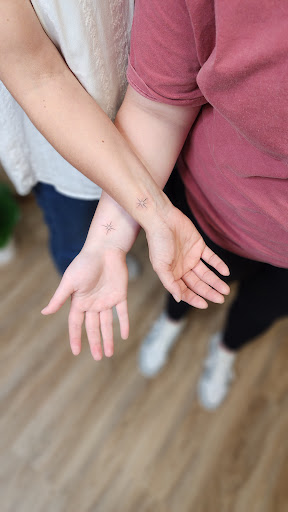 Explore purple rose tattoo ideas, creative tattoo ideas in Fountain City, available at Innate Ink & Beauty
