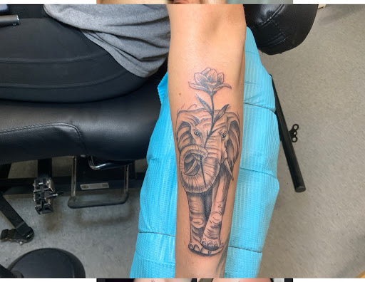 Explore small dog tattoo ideas, creative tattoo ideas in Lansing, available at Luckys Tattoos