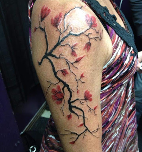 Explore female spine tattoo ideas, creative tattoo ideas in Savannah, available at Tattoo Addictions