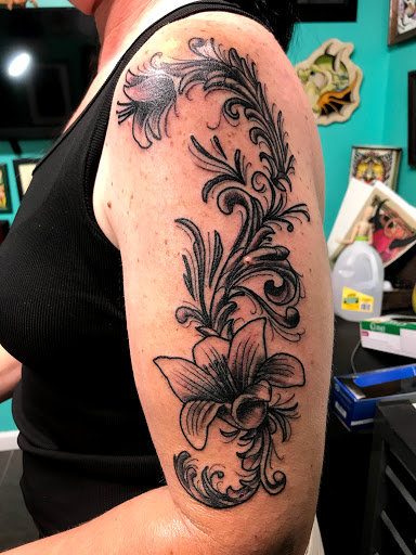 Explore hand name tattoo ideas, creative tattoo ideas in Kansas City, available at Golden Stag Tattoo and Gallery